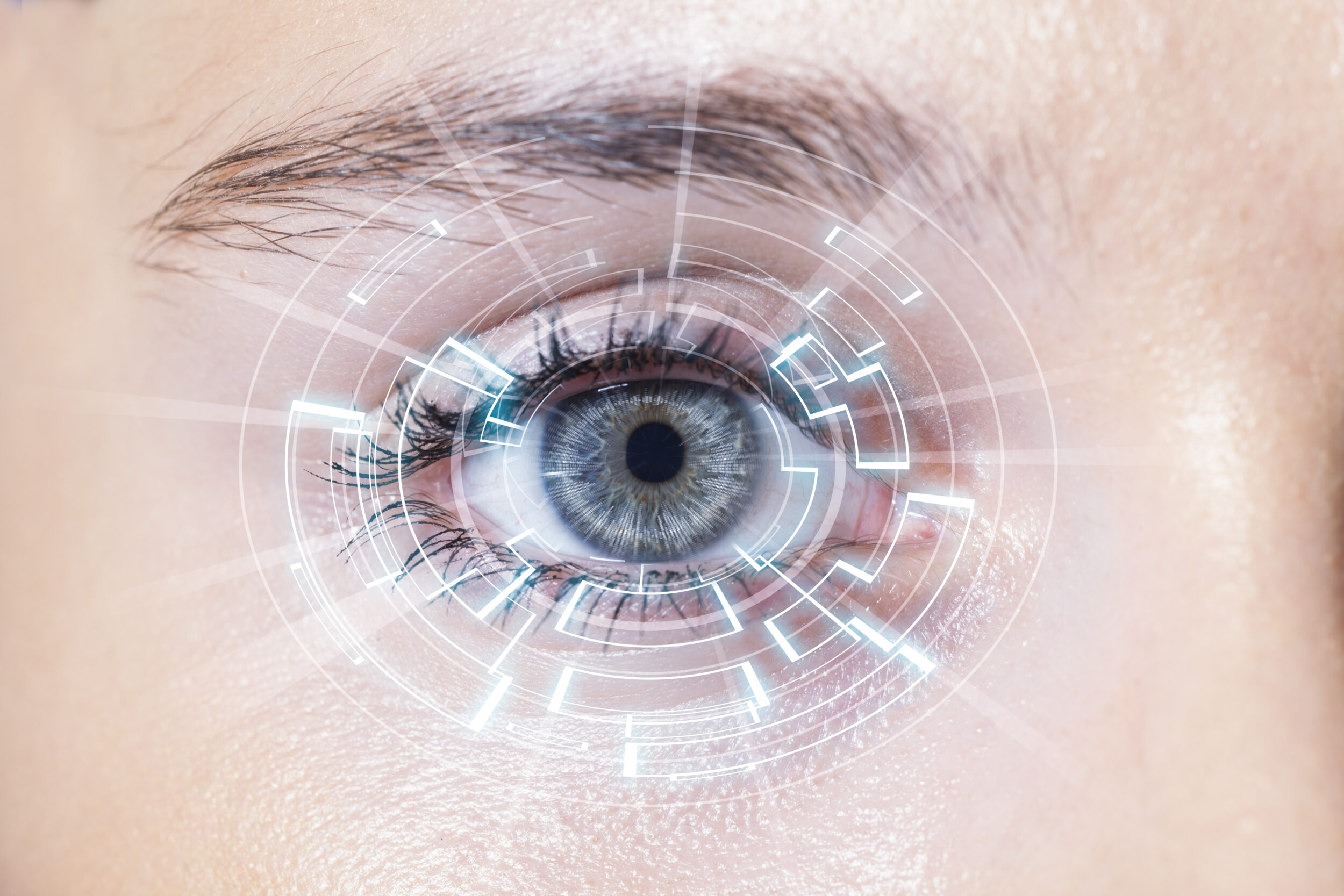 Close-up of woman's blue eye. High Technologies