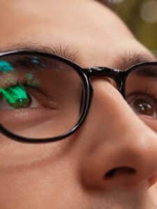 closeup-of-man-wearing-glasses-browneyed-guy-looking-up-healthy-sight-picture-id1010145326