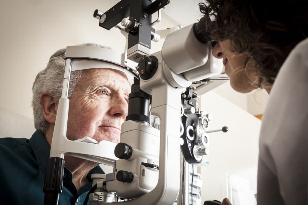 elderly patient undergoing a cataract evaluation to see if cataract surgery at North Suburban Eye is right for them