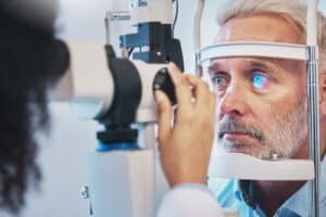 Man in his 50s undergoes a comprehensive vision screening to check for hidden signs of glaucoma.