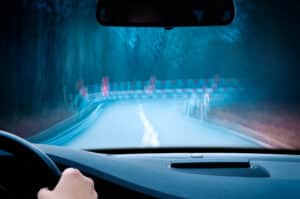 Driver notices blurred or distorted vision at night.
